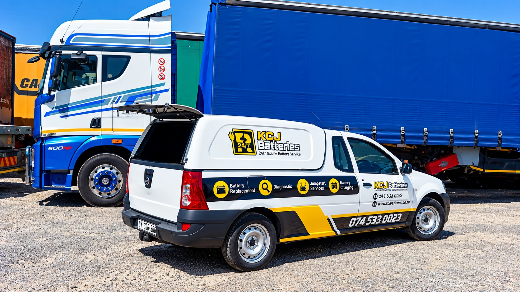 KCJ Batteries branded van with a delivery truck during a truck and bus battery service in Cape Town